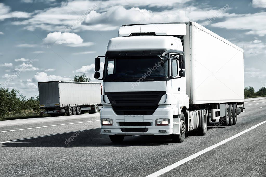 Truck on road, blue sky, cargo transportation concept