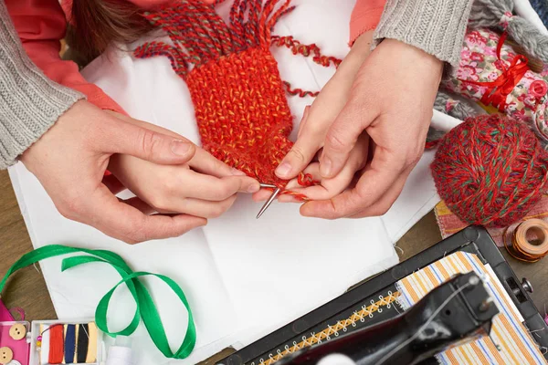 Mother teaching daughter girl knit, top view, sewing accessories top view, seamstress workplace, many object for needlework, handmade and handicraft — Stock Photo, Image