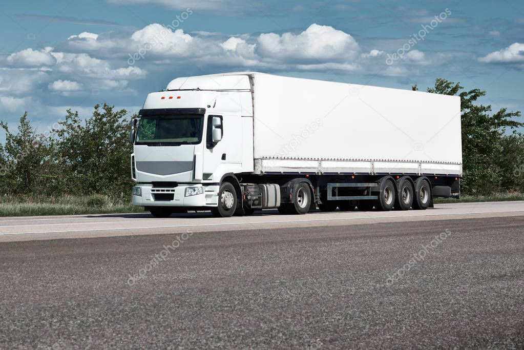 Truck on road, blue sky, cargo transportation concept