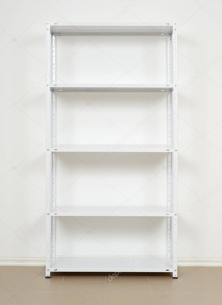 white metal rack near the wall, empty shelves