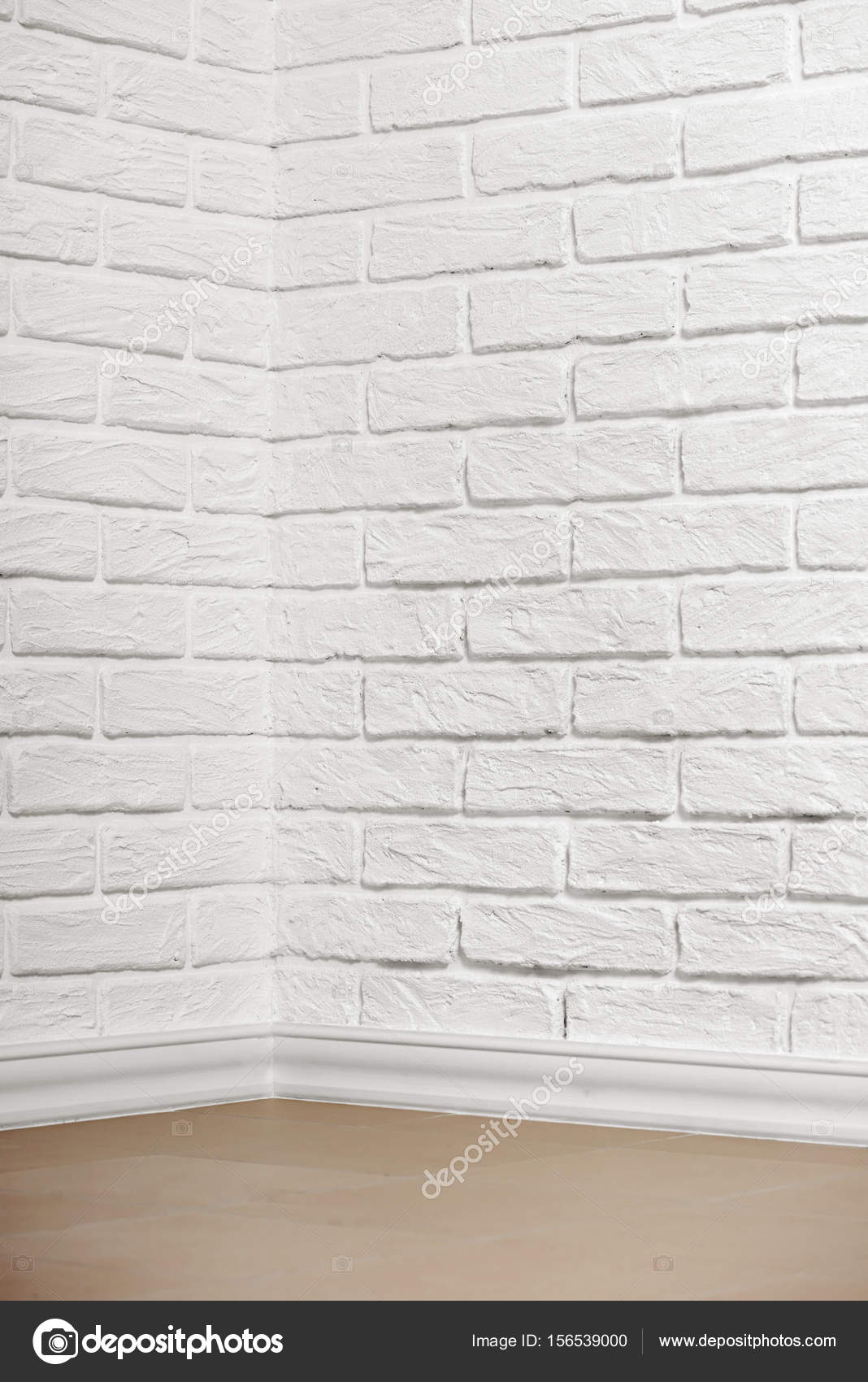 pared de ladrillo blanco con suelo de baldosa y esquina, Foto de