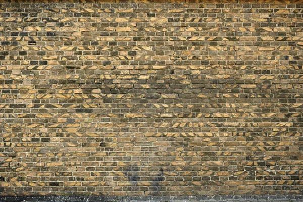 Stary mur z cegły dla tekstury lub tło, kolor żółty i czarny — Zdjęcie stockowe