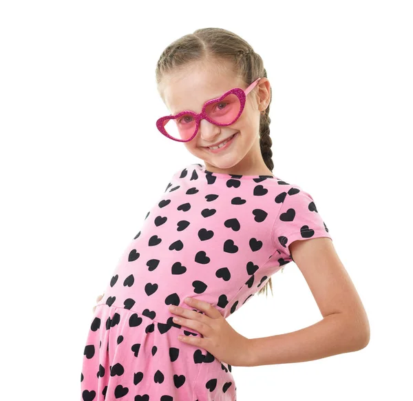 Pretty little girl studio portrait, dressed in pink with heart shapes, white background — Stock Photo, Image