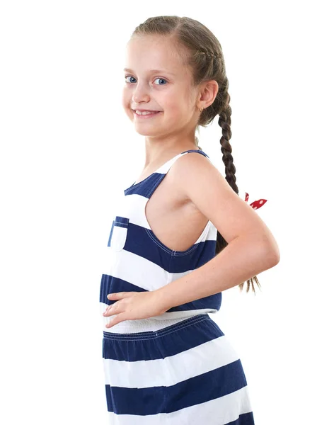 Çizgili elbise stüdyo portre, beyaz arka planda sevimli küçük kız — Stok fotoğraf