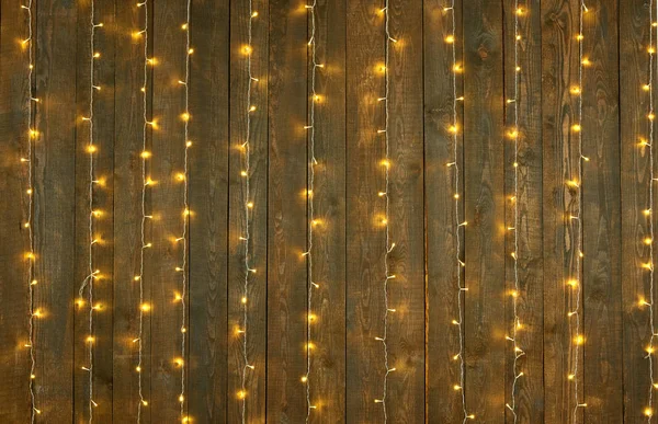 Dark wood background with lights, abstract holiday backdrop, copy space for text — Stock Photo, Image
