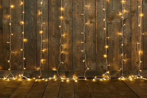 Dark wood background with lights, wall and floor, abstract holiday backdrop, copy space for text — Stock Photo, Image