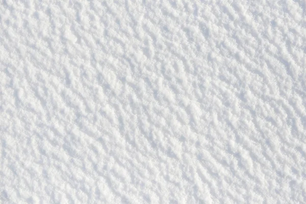 Sneeuw voor textuur of achtergrond op zonnige dag, fel licht met schaduwen, plat lag, top uitzicht, schoon en niemand — Stockfoto