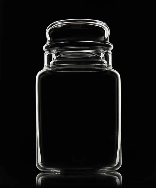 White silhouette of empty glass jar on a black background — Stock Photo, Image