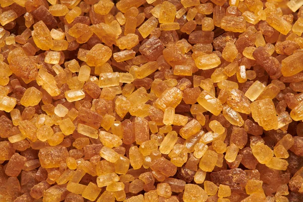 Makro zdjęcie cukru trzcinowego do tła lub tekstury — Zdjęcie stockowe