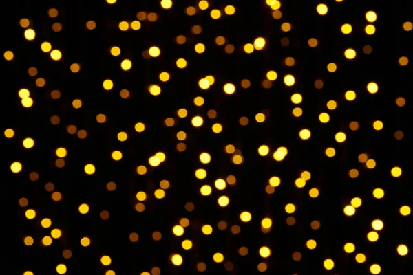 Abstract background - photo of yellow bokeh on a black — Stock Photo, Image