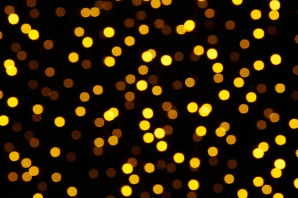 Abstract background - photo of yellow bokeh on a black — Stock Photo, Image