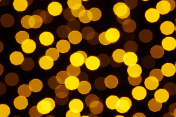 Fond abstrait - photo de bokeh jaune sur un fond noir — Photo