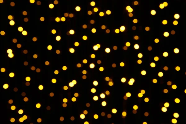 Abstract background - photo of yellow bokeh on a black — Stock Photo, Image