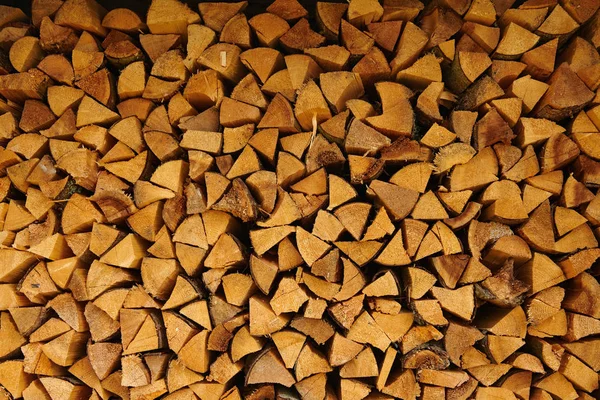 Pile of wood cut for fireplace — Stock Photo, Image