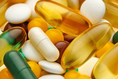 Background from set of pills, tablets, vitamins, drugs, omega 3 fish oil, gel capsules, medicament and food supplement for health care. Pharmaceutical industry. Pharmacy. Macro photo.