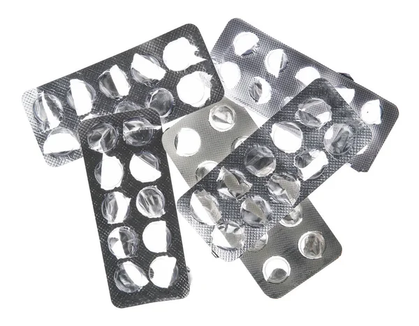 Použité pilulky puchýře, prázdné, otevřené bez pilulek na bílém pozadí - zdravotní péče a léky koncept. Farmaceutický průmysl. Lékárna. — Stock fotografie