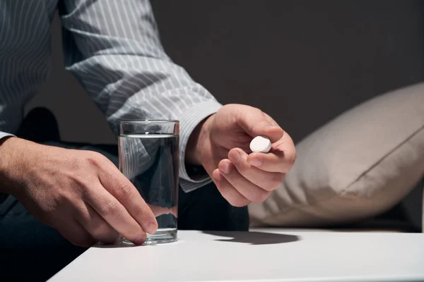 Overworked Businessman Sitting Sofa Taking Medication Pills Glass Water Him — Stock Photo, Image