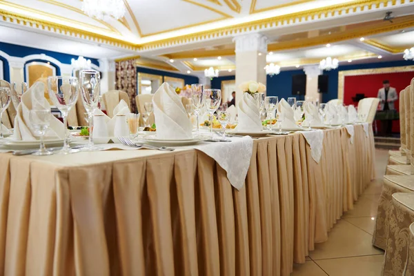 a table set in the restaurant, food and drink, master of ceremonies on a stage