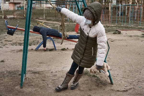 Concept Epidemic Quarantine Girl Boy Face Mask Alone Playground City — Stock Photo, Image