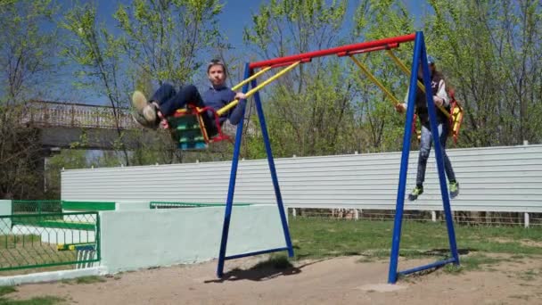 Children Ride Swings Play Playground Next Condominium Place Children Play — Stock Video