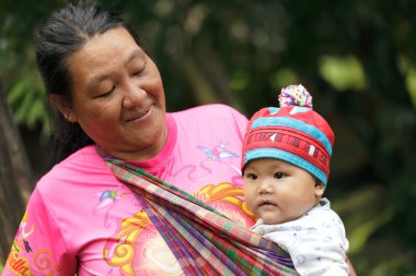 Asian tribe woman and her baby clipart