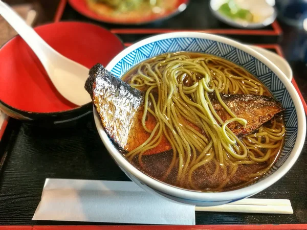 Japanese soup with soba noodle and fish — Stock Photo, Image