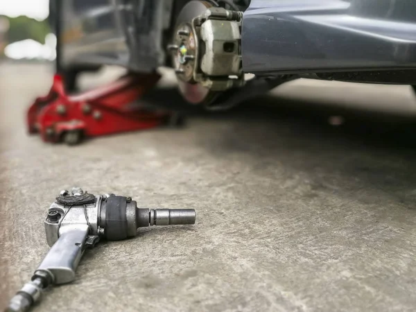 Screwing mechanic object at garage — Stock Photo, Image