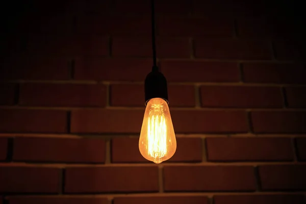 Single light bulb hanging — Stock Photo, Image