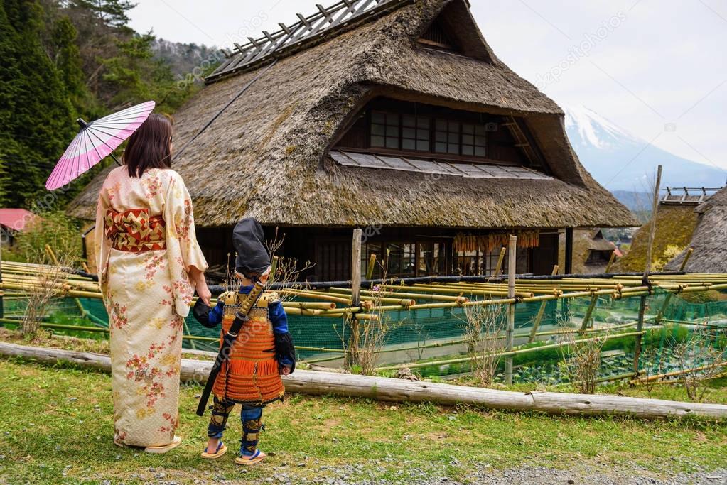 Samurai child and mother in old village