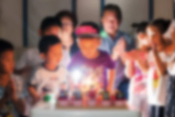 Blurred image of blowing birthday cake candle — Stock Photo, Image