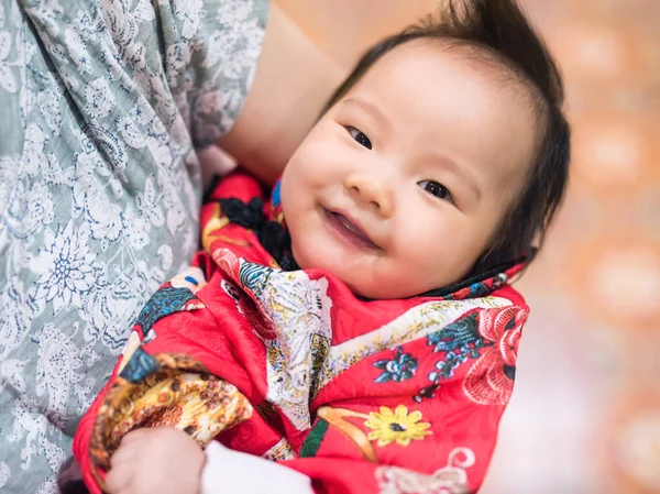 Asian Baby with red costume for Chinese new year — Stock Photo, Image