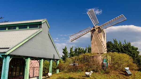 Windmill and fake sheep in farmland — Stock Photo, Image