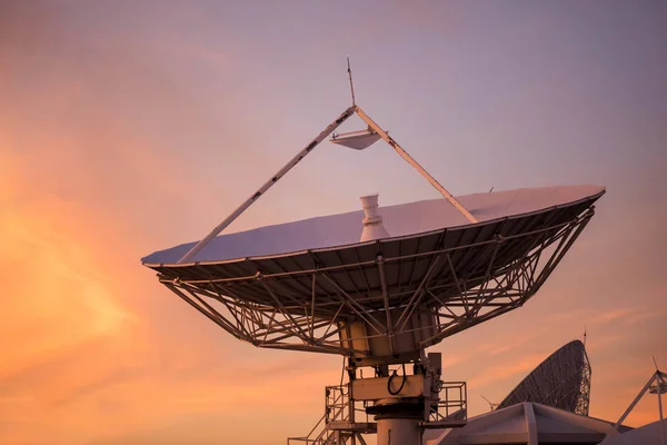 Satellite dish or antenna with twilight sky — Stock Photo, Image