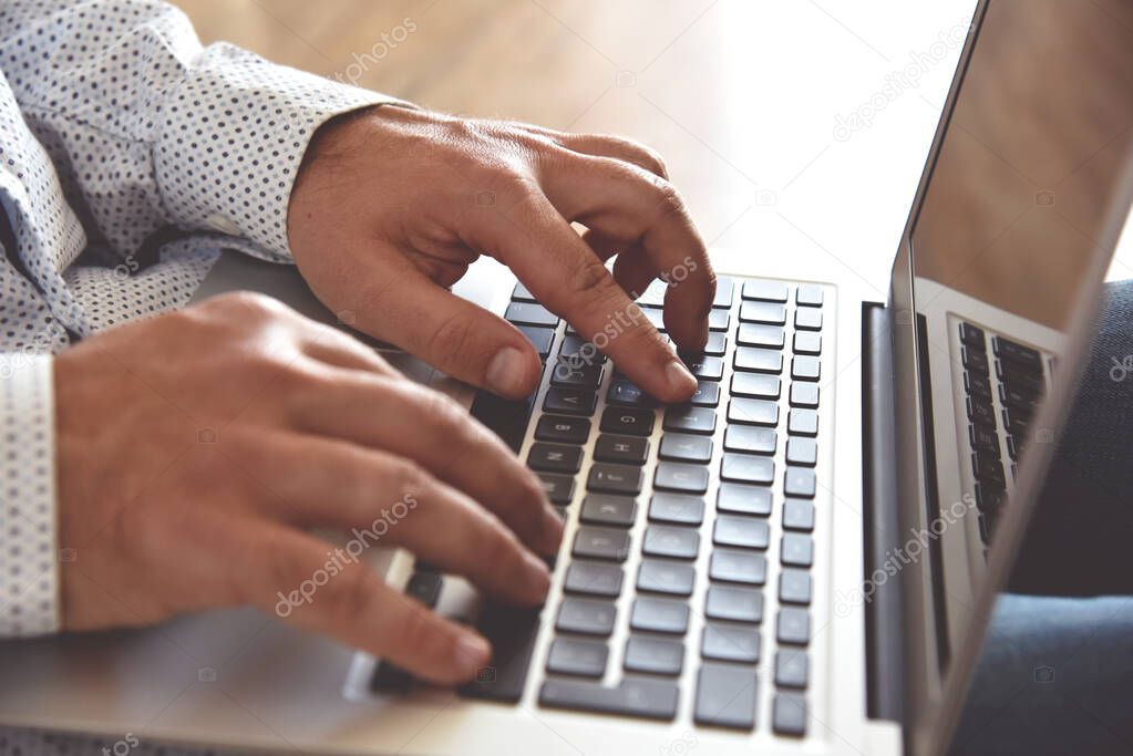 Businessman typing on laptop keyboard. Concept for background, website banner, poster, presentation templates, social media, advertising and printed materials. 