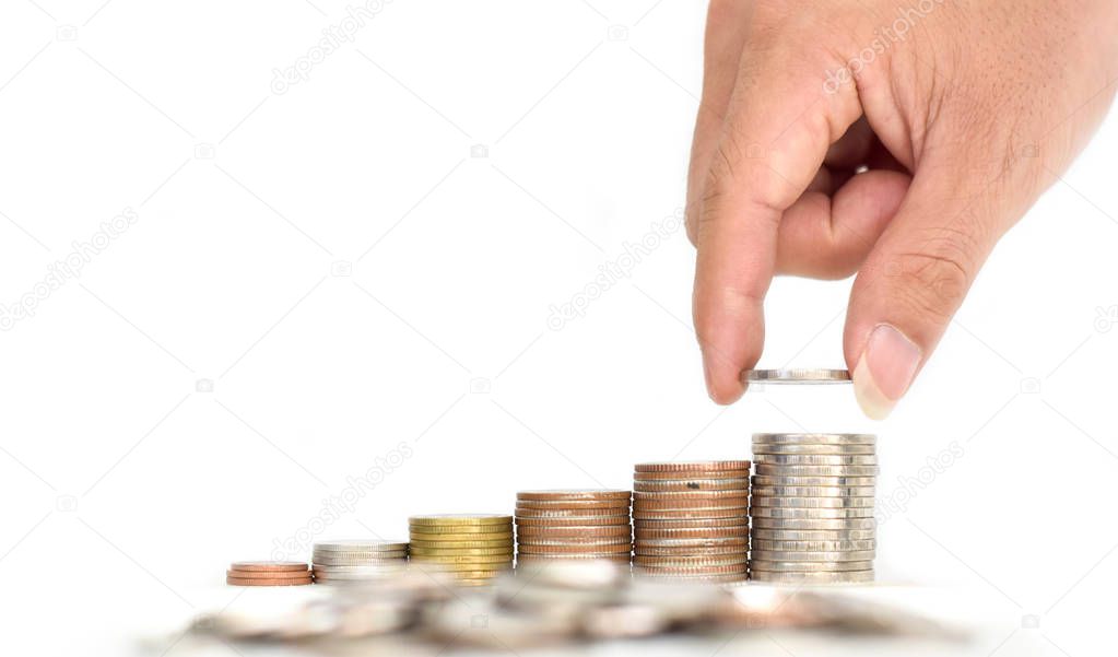 Man's hand put money coins to stack of coins on white background. Financial, Business growth concept