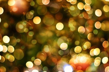 Odaklanamayan parlak ışığın renkli Noel Bokeh arka planı