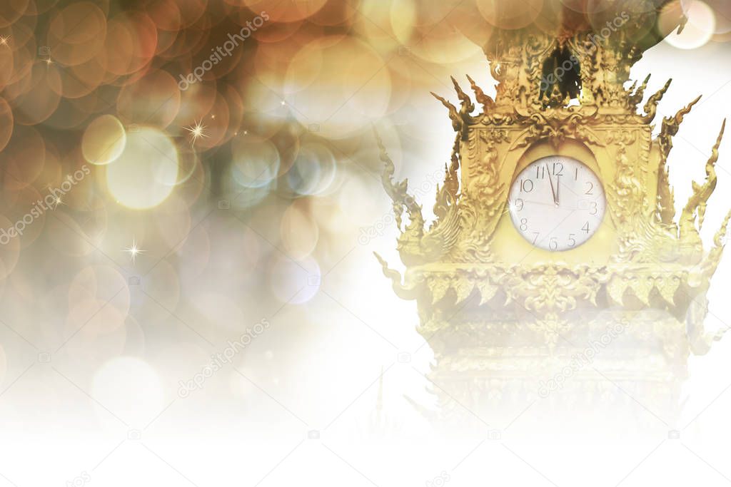 New Year's at midnight concept. Clock tower with bokeh background.