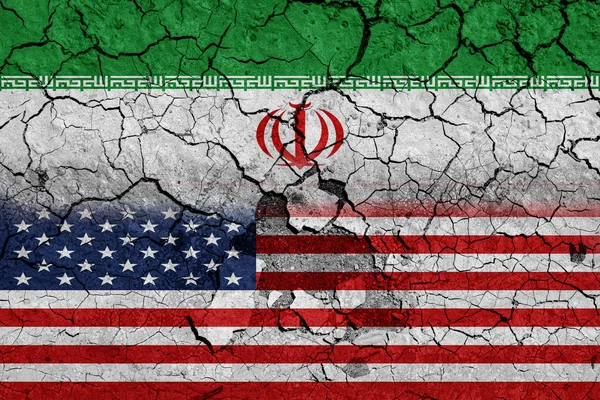 Flag of USA and Iran on cracked concrete wall background. Concept of Conflict between war America vs Iran
