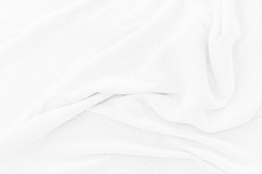 Yumuşak beyaz kumaş dokusu arka planı. Duvar kağıdı veya arkaplan için yumuşak dalgalı soyut kumaş