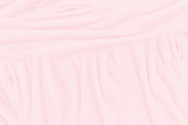 Yumuşak pembe kumaş dokusu arka planı. Duvar kağıdı veya arkaplan için soyut kumaş ipeği