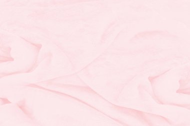 Güzel pembe kumaş dokusu arkaplanının yakın çekimi.