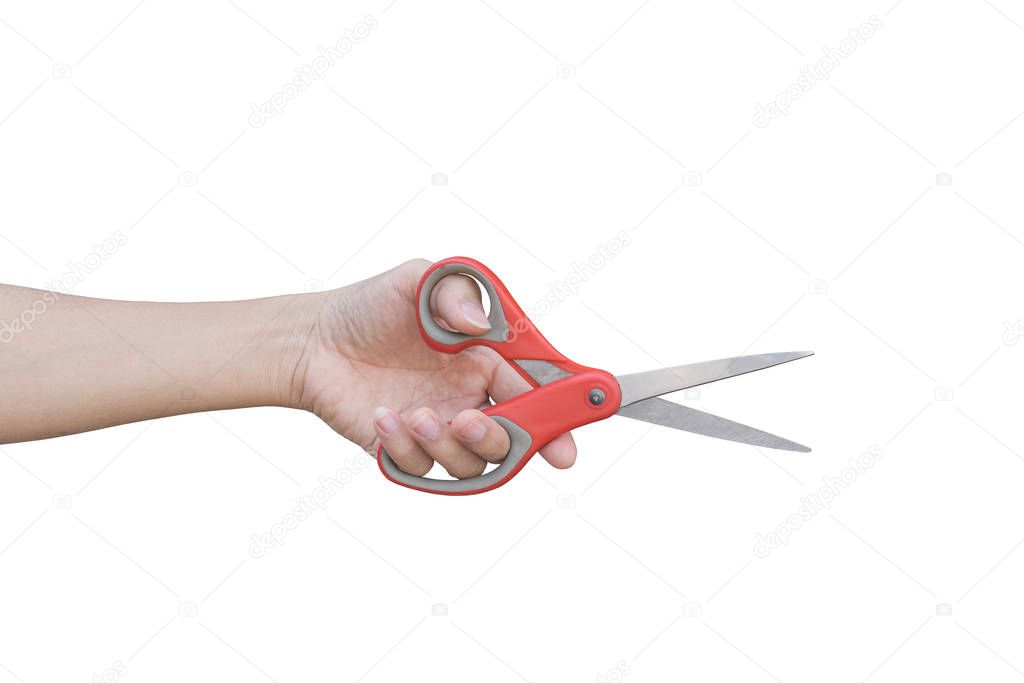 hand holding red scissors isolated on white background with clipping path.