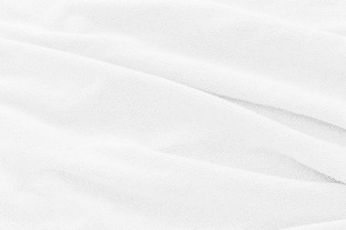 Yumuşak beyaz kumaş dokusu arka planı. Duvar kağıdı veya arkaplan için yumuşak dalgalı soyut kumaş