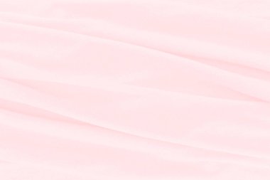 Güzel pembe kumaş dokusu arkaplanının yakın çekimi.
