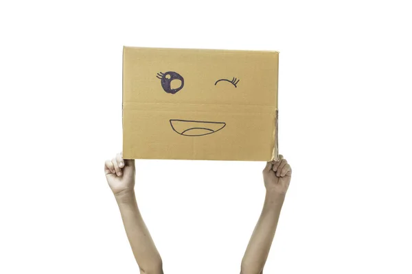 Mano Niño Sosteniendo Una Caja Cartón Con Cara Sonriente Aislada —  Fotos de Stock