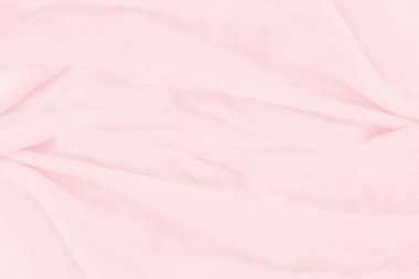 Güzel pembe kumaş dokusu arkaplanının yakın çekimi.