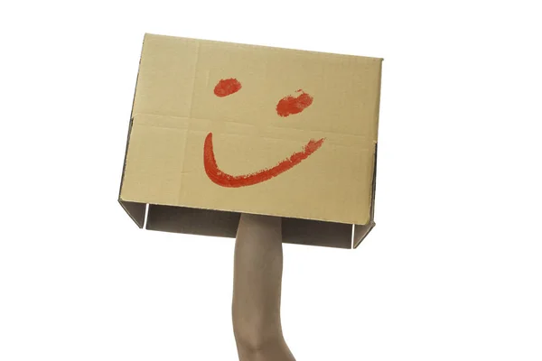 Χέρι Κρατώντας Ένα Χάρτινο Κουτί Χαμογελαστό Πρόσωπο Απομονωμένο Λευκό Φόντο — Φωτογραφία Αρχείου