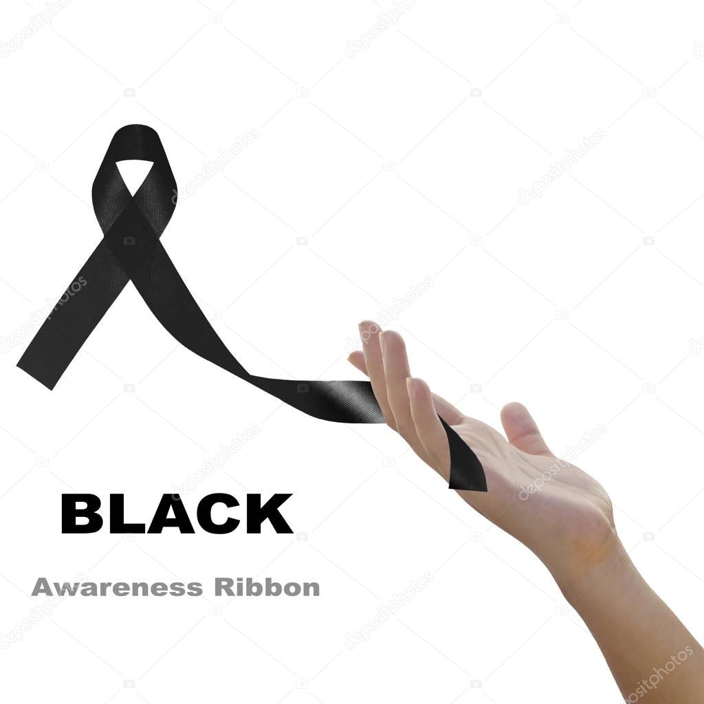 Woman hand holding black  ribbon  against white background for M