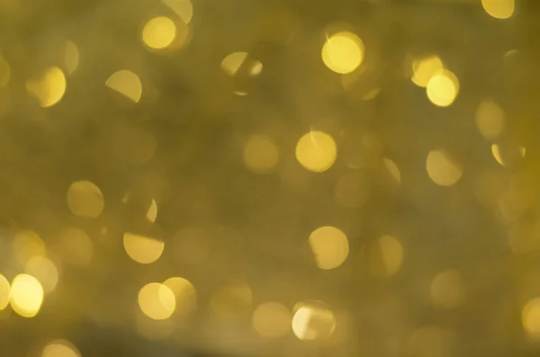 Abstrakt bakgrund av goldenl oskärpa bokeh — Stockfoto