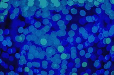 Fosforlu bokeh ışıklarının soyut arkaplanı